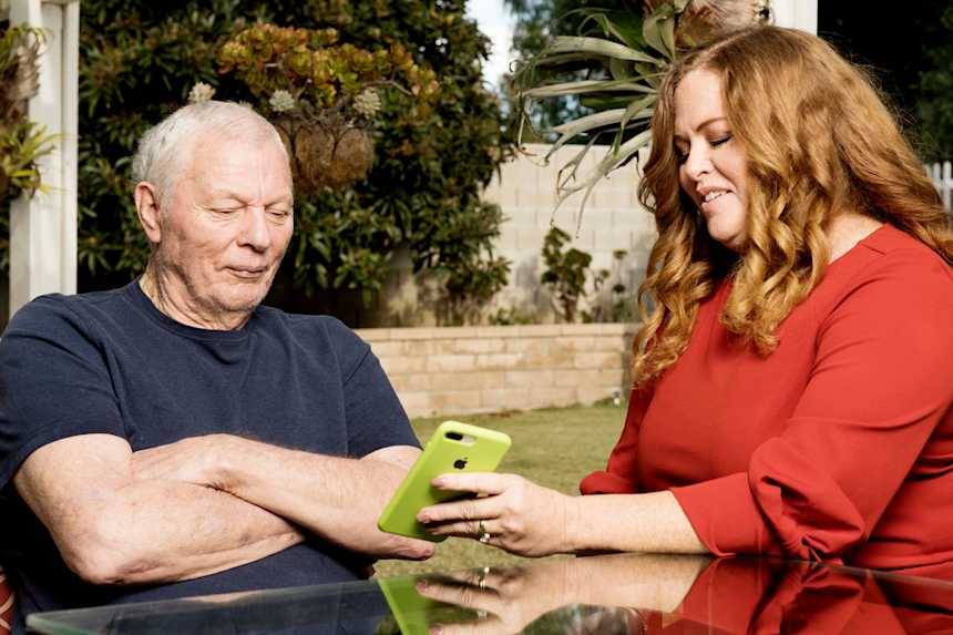 Each time she visits her father, Marv, Traci Marinovich shows him old family photos.